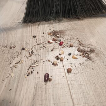 broom and floor sweeping pile